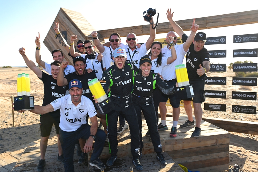 MARCH 11: Kevin Hansen (SWE), Veloce Racing, and Molly Taylor (AUS), Veloce Racing, 1st position, celebrate with their team on the podium during the Desert X-Prix on March 11, 2023. (Photo by Sam Bagnall / LAT Images)